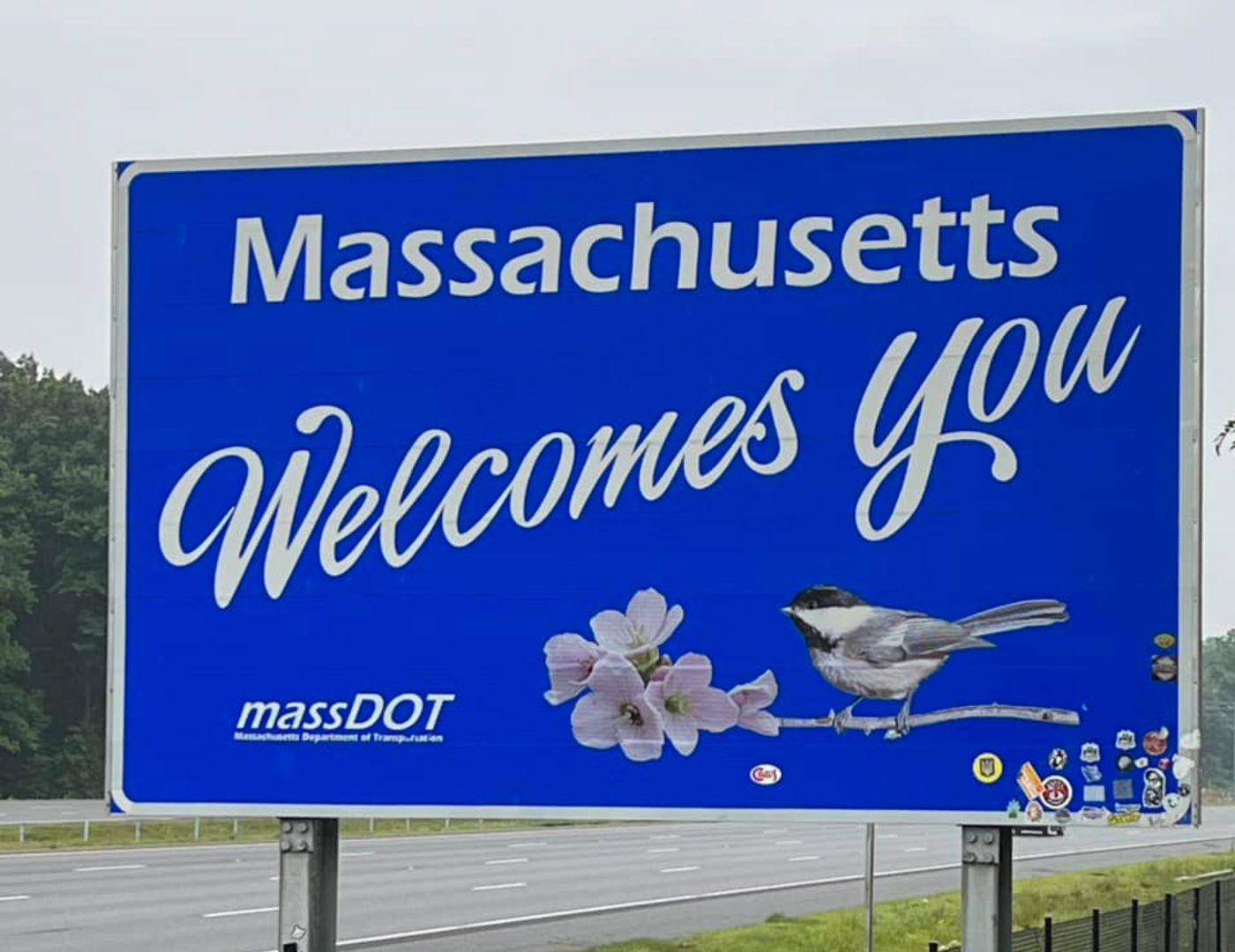 Massachusetts welcomes you road sign