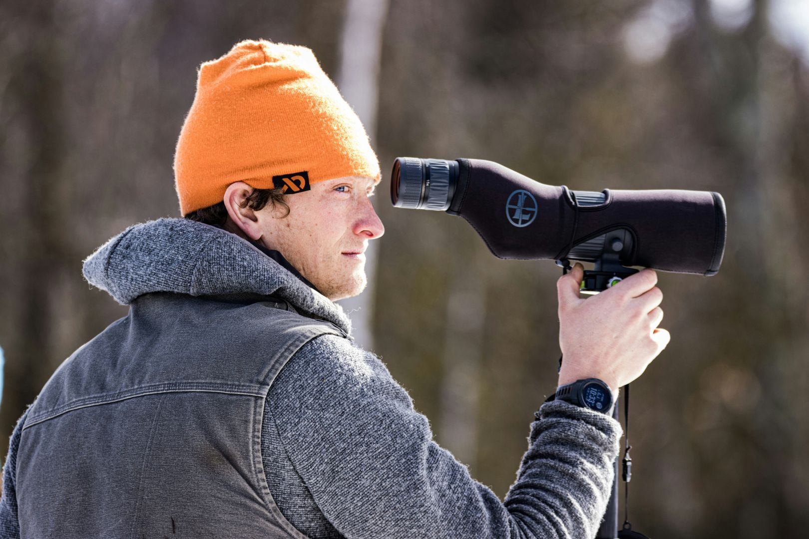 man using monocular scope